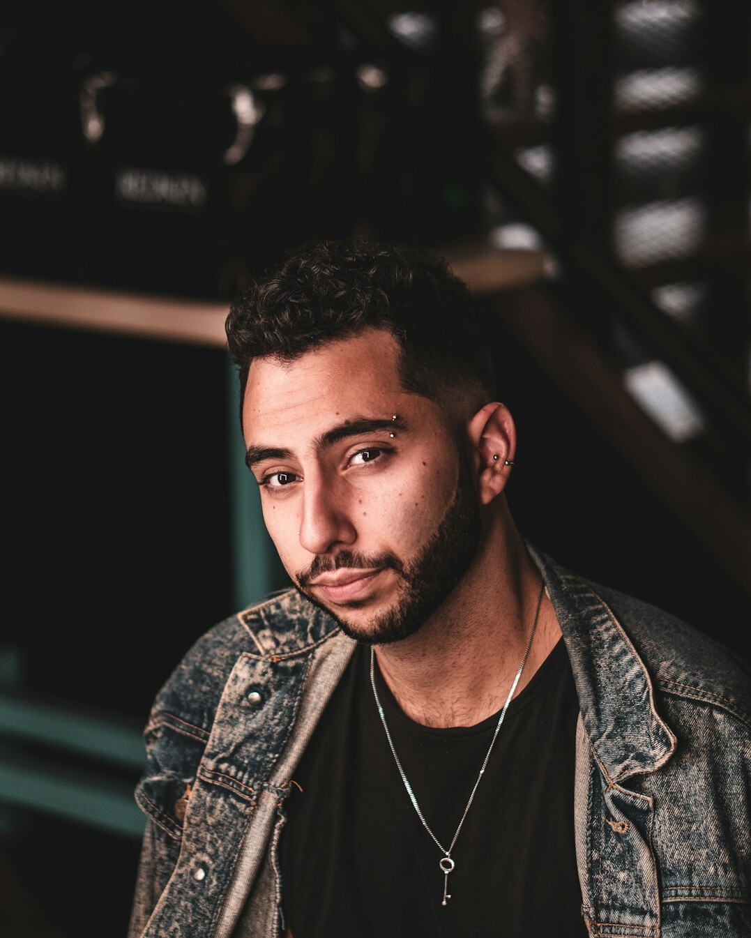 Portrait of a man with a short beard looking at the camera